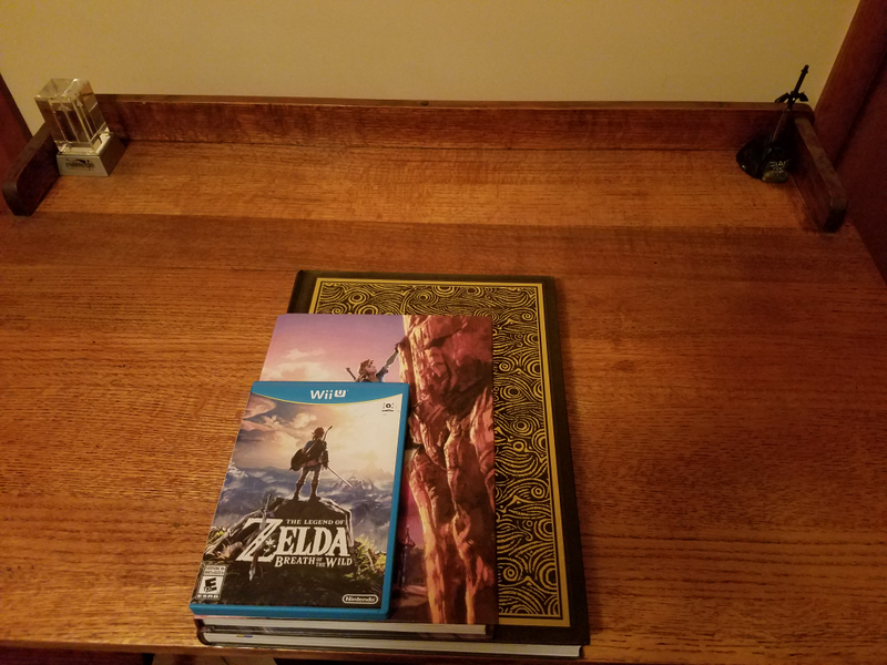 Stacked size comparison of the two releases, with a WiiU (standard DVD case-size) case as well to give a reference. I say it a lot, but the Deluxe guide is MASSIVE.